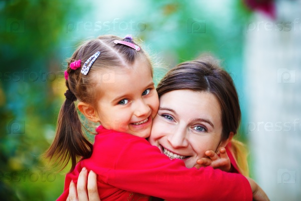 Embrace mother with little daughter. Mom and child girl. Happy family. Shallow depth of field. Selective focus, stock photo