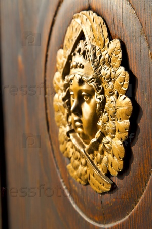 gold face house door in italy lombardy column the