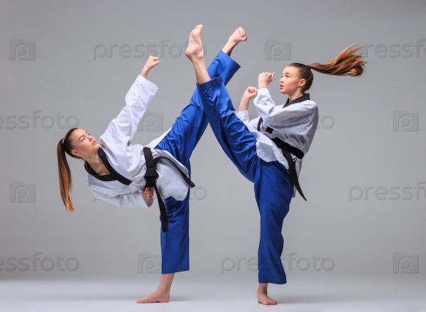 The collage of karate girl in white kimono and black belt training karate over gray background, stock photo
