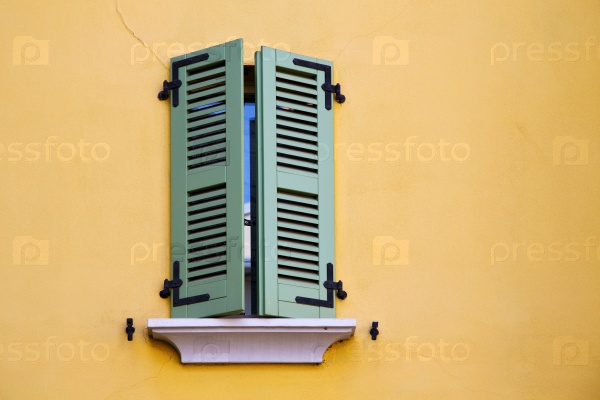 abbiate varese italy abstract  window   green in the yellow wall