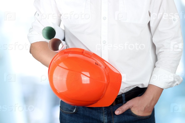 engineer holding orange helmet for workers security