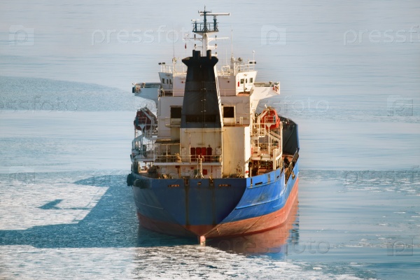 Cargo ship on the ice sea