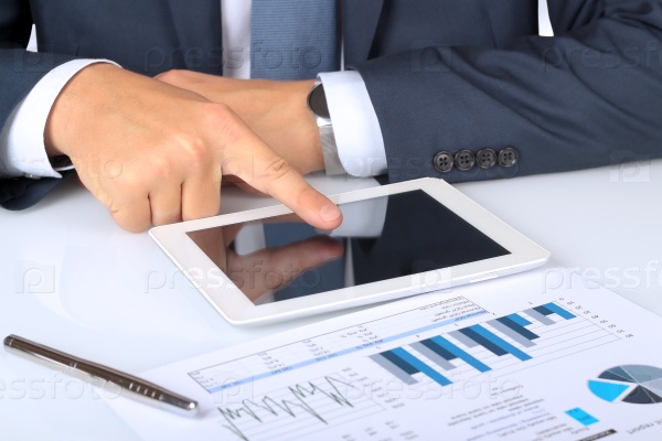 Close-up Of Businessman Analyzing Graph On Digital Tablet