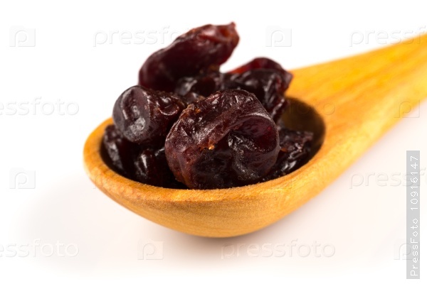 Pieces of dried cherry isolated on white background, stock photo