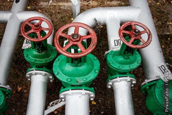 Oil and gas pipe line and old green valves, stock photo
