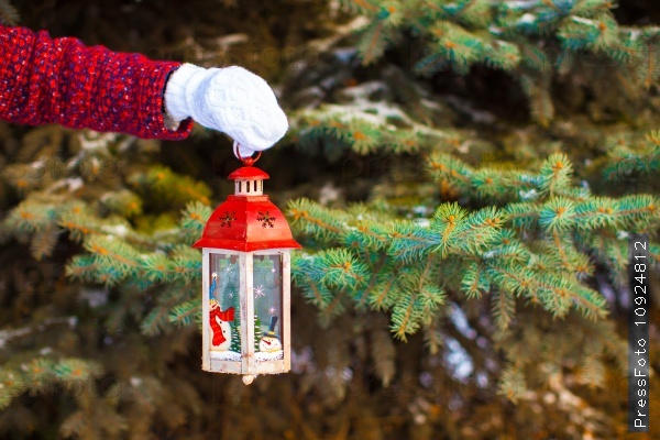 Closeup of a hand holding beautiful vintage Christmas lantern