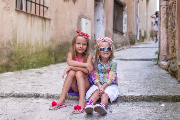 Adorable little girls outdoors in European city