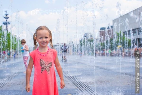 Adorable little girl have fun at hot sunny summer day
