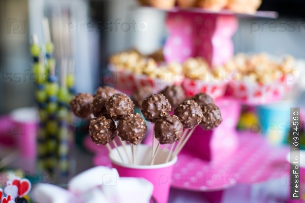 Chocolate cakepops on holiday dessert table at kid birthday party