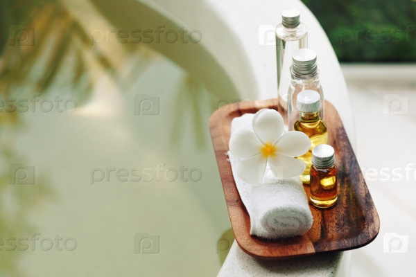 Spa decoration, natural organic bath products on a wooden tray in the bathroom, stock photo