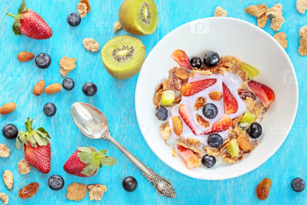 Cereal with berries, milk and yogurt, healthy breakfast concept, top view, stock photo