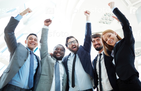 Business team raising hands and expressing triumph, stock photo