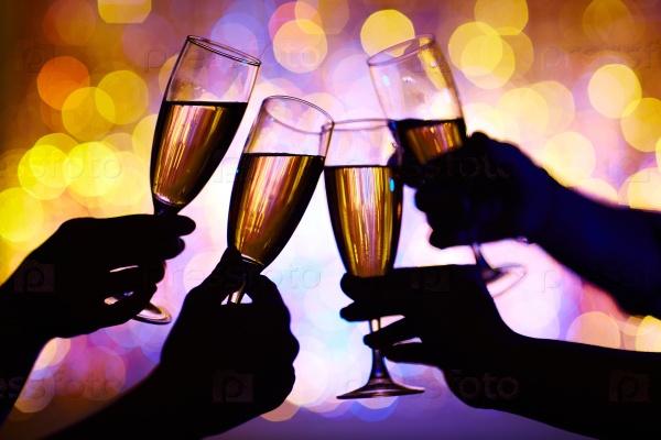 Hands of humans toasting with champagne at party, stock photo