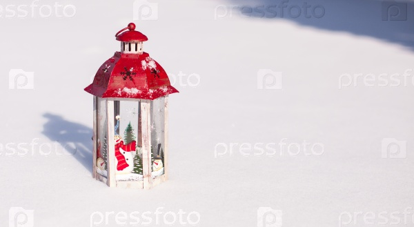 Decorative Christmas lantern in snow winter day