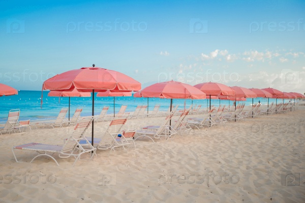 Paradise view of tropical empty sandy beach umbrella