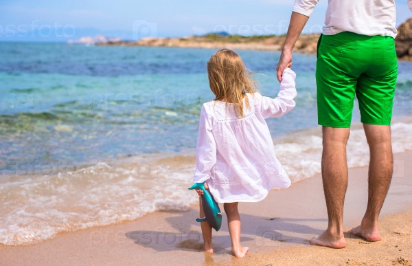 Happy father and adorable little daughter on the beach, stock photo