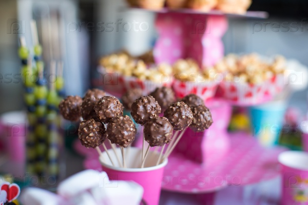 Chocolate cakepops on holiday dessert table at kid birthday party