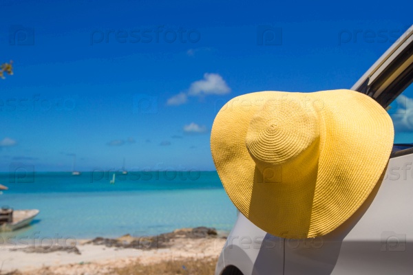 Yellow hat on the car at caribbean island