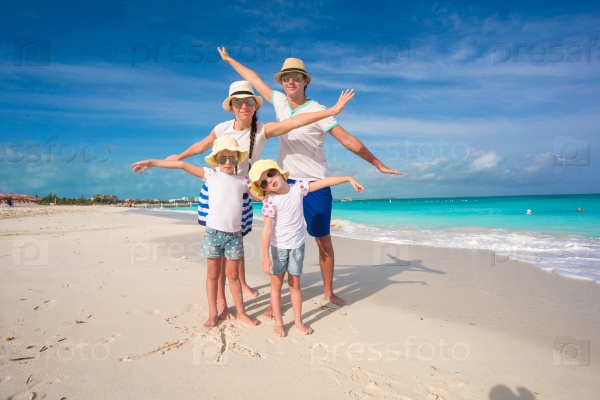 Happy family with two girls on summer vacation