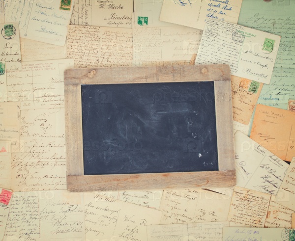 Vintage mail and blank blackboard with copy space, retro toned, stock photo
