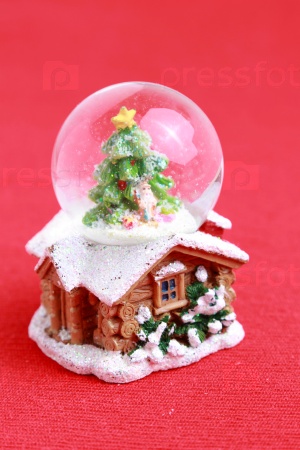 Christmas globe with small house inside