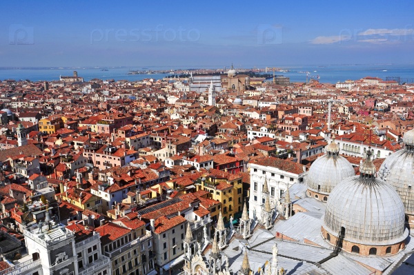 aerial view of the Patriarchal Cathedral Basilica of Saint Mark and the roofs of Venice, Italy