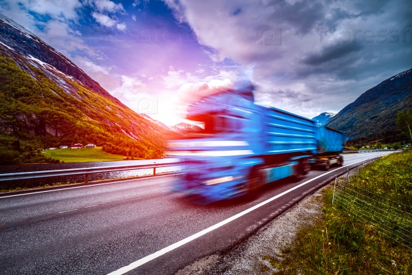 Truck and highway at sunset. Truck Car in motion blur, stock photo