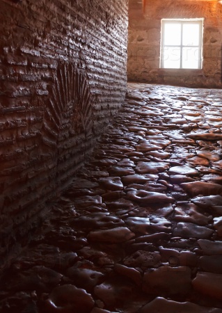 dark hallway with polished pebbles on the floor passageway inside Hagia Sophia Basilica, Istanbu Turkey