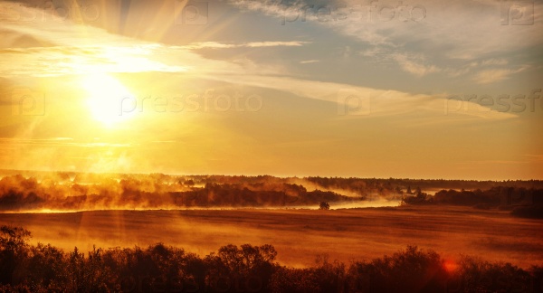 sunrise with the mist over the river and the forest in central Russia in the summer