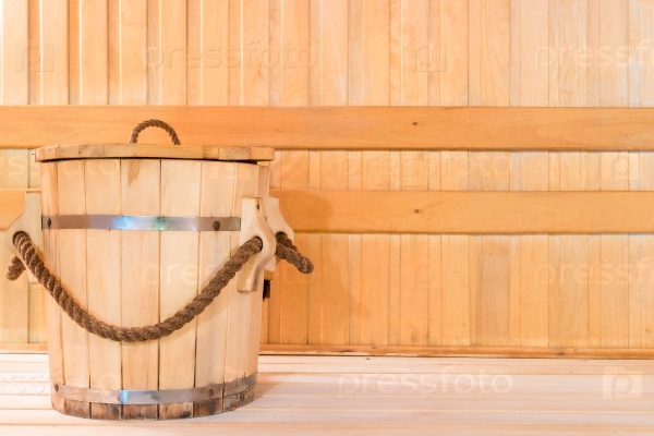 Wooden tub for water in sauna close up, stock photo