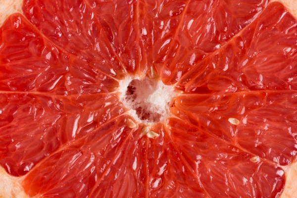 Close up image of sliced red grapefruit, stock photo
