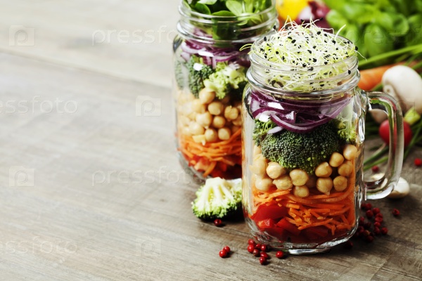 Healthy Homemade Mason Jar Salad with Chickpea and Veggies - Healthy food, Diet, Detox, Clean Eating or Vegetarian concept, stock photo