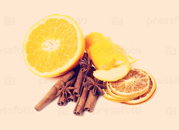 Cinnamon with orange on the table