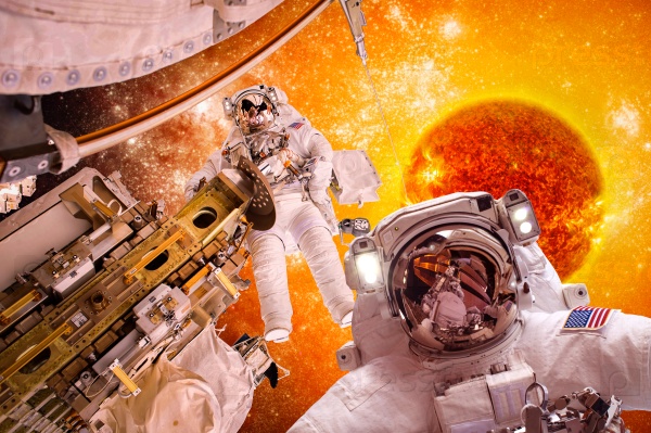 Spacecraft and astronauts in space on background sun star. Elements of this image furnished by NASA, stock photo