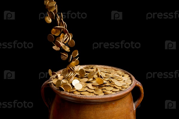 gold coins falling in the vintage pot isolated on black background