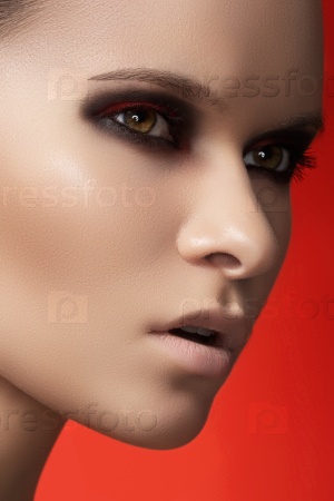 Fashion model face with dark make-up & purity skin