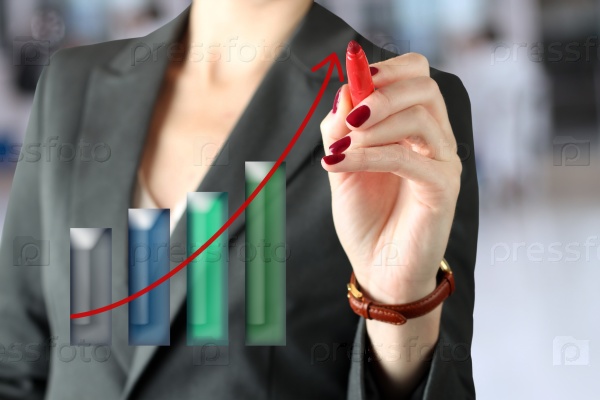 Businesswoman showing something on a virtual graph by a pen