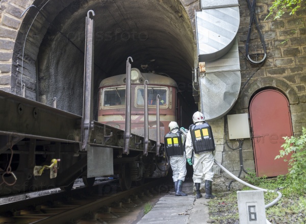 Team working with toxic chemicals is saving people from a chemical cargo train crash near Sofia. Teams from Fire department are participating in a training with spilled toxic and flammable materials.