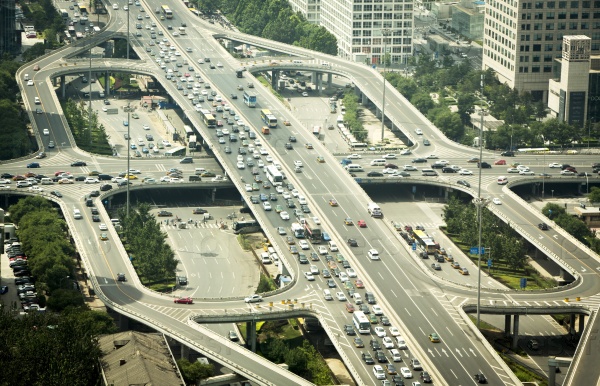 Beijing, China - August 5, 2014: Cars stuck in a traffic jam during a rush hour on a busy road intersection in Beijing, China.