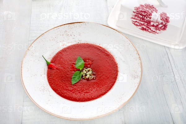 Tomato gazpacho soup with pepper and garlic, Spanish cuisine, top view, stock photo