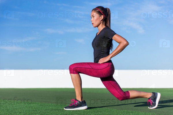 Fitness woman doing lunges exercises for glute and leg muscle workout training core muscles, balance, cardio and stability. Active girl doing front forward one leg step lunge exercise.