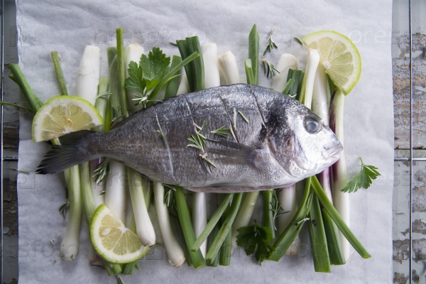 Presentation and preparation of a second dish of sea bream and onions