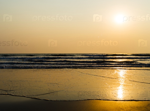 Horizontal vivid golden tidal waves with sun reflection background backdrop