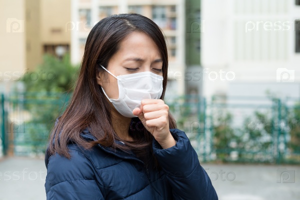 Asian woman sick and wearing face mask