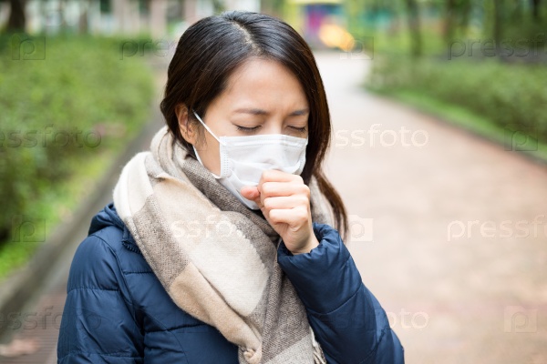 Asian woman sick and wearing face mask