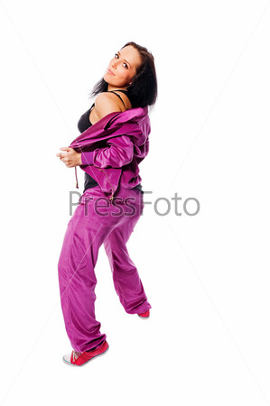 Фотография на тему Брюнетка в фиолетовом спортивном костюме танцует на белом фоне