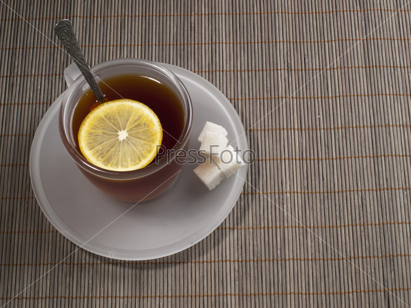 Фотография на тему Чашка чая с лимоном и сахаром на столе крупным планом |  PressFoto
