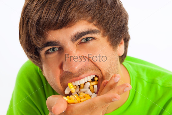 Man eating pills        