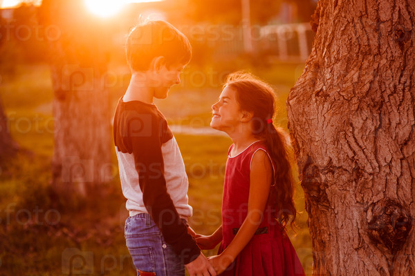 Boy Girl Teens Are Holding Hands Romance Friendship Love At Suns