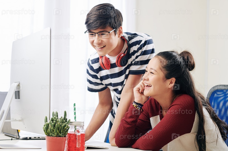 Brother and sister watching funny videos